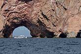 boat in front of Perce rock in Gaspesie in Quebec, pierced rock