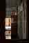 Abandoned school corridor with opened door and water on floor